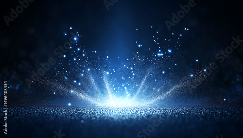 A digital image depicting a vibrant blue glitter explosion on a dark background.  Bright sparkles radiate outwards from a central point creating a dynamic effect.