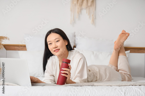 Young Asian woman with ther...