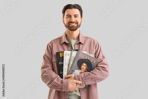 Handsome man with magazines...