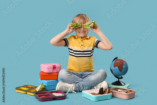 Little boy with sandwiches ...