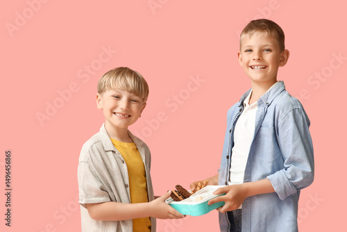 Little boys with lunchbox o...