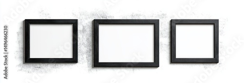 Three empty black picture frames of varying sizes hung on a white textured wall, creating a minimalist and modern display
