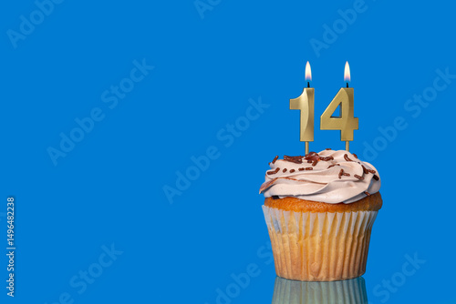 Birthday Or Anniversary Cupcake with Lit Candle; Number 14 Candle.