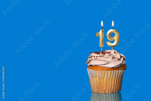 Birthday Or Anniversary Cupcake with Lit Candle; Number 19 Candle.