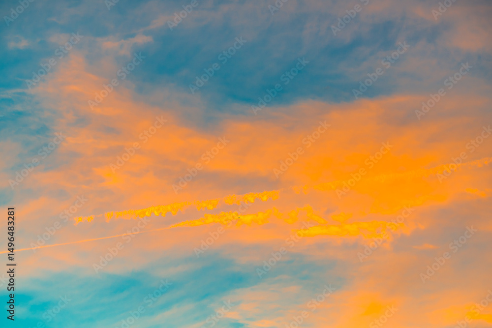 Fototapeta premium Blue sunset sky with white clouds