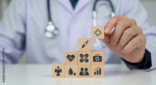 Doctor Stacking Healthcare Icons on Wooden Blocks for Medical Concept