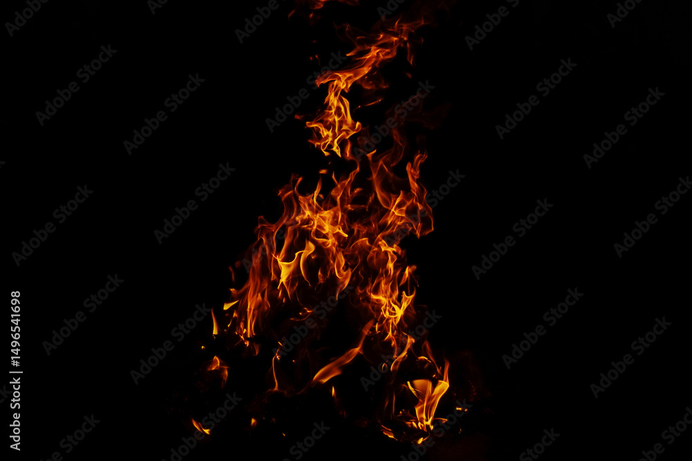 Obraz premium Fiery Flames Dancing in the Darkness