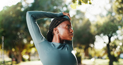 Fitness, workout and black woman with stretching at park to start exercise, cardio performance and getting ready. Wellness, runner and arm warm up in nature for training and muscle tension relief
