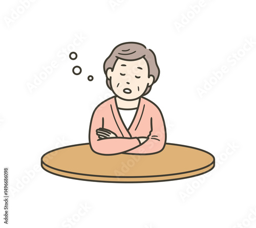 テーブルにもたれて居眠りをする高齢女性