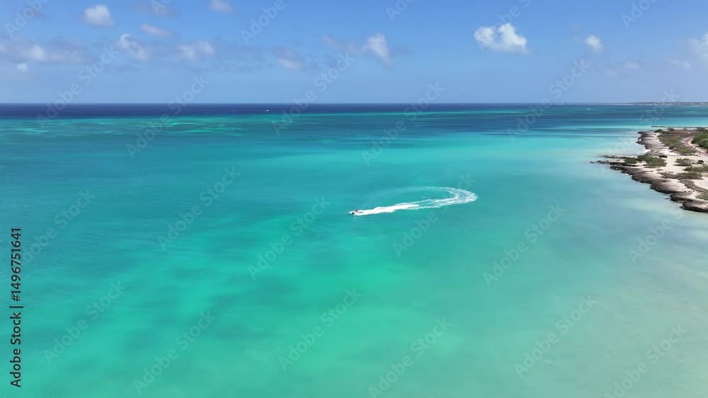Jet Ski Sailing In Eagle Beach Caribbean Netherlands Aruba. Boat Sailing In The Summer Landscape Viewed From Above. Shore Clouds Beach Sea. Outside Beach Panoramic. Eagle Beach Caribbean Netherlands. Jet Ski Sailing In Eagle Beach Caribbean Netherlands Aruba. Boat Sailing In The Summer Landscape Viewed From Above. Shore Clouds Beach Sea. Outside Beach Panoramic. Eagle Beach Caribbean Netherlands.