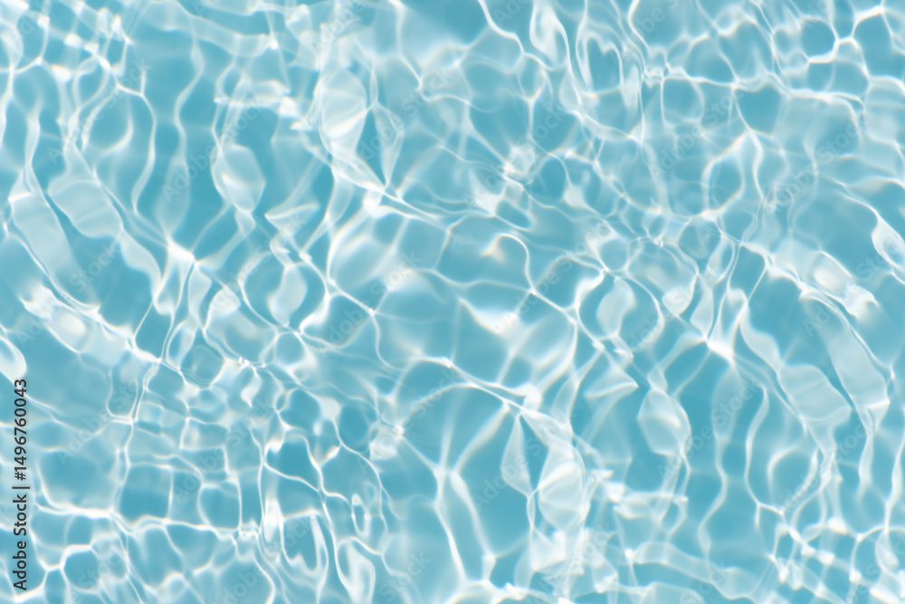 Obraz premium Blue water with ripples on the surface. Defocus blurred transparent blue colored clear calm water surface texture with splashes and bubbles. Water waves with shining pattern texture background.