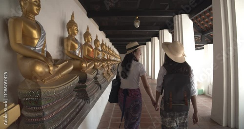 Asian female tourists visit Ancient Historical Park at Ayutthaya,Thailand.