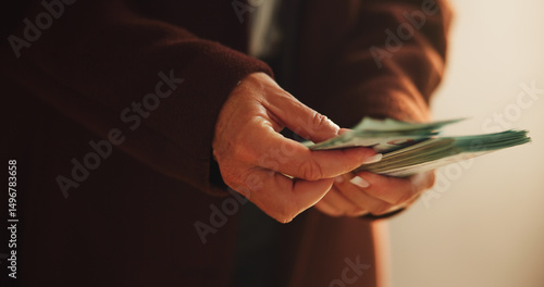 Hands, cash and counting in office for corruption, payment and crime for money laundering scam at corporate company. Person, worry and fraud with bribe, illegal profit and secret deal at agency