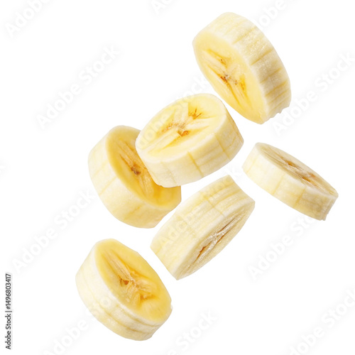 A close up shot of several banana slices floating in the air on a plain white background studio shot