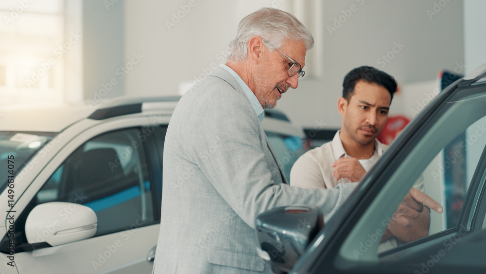 Customer, man and sale at car dealership for advice, consulting or negotiation in vehicle finance. Deal, discussion and shopping on showroom floor with trade representative for auto insurance Customer, man and sale at car dealership for advice, consulting or negotiation in vehicle finance. Deal, discussion and shopping on showroom floor with trade representative for auto insurance