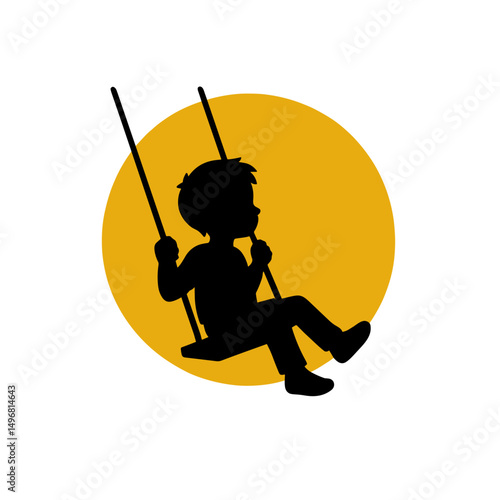 Boy swinging in silhouette against yellow full moon