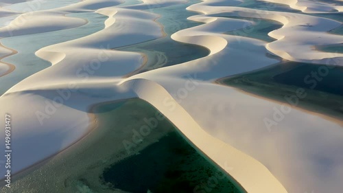Lencois Maranhenses Skyline In Barreirinhas Maranhao Brazil. Natural Freshwater Lagoon Nestled Between White Sand Dunes. Shore Clouds Beach Sea. Outside Beach Panning Wide. Barreirinhas Maranhao.