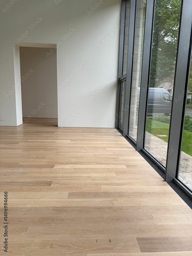 Fototapeta premium Empty room with panoramic windows and wooden floor