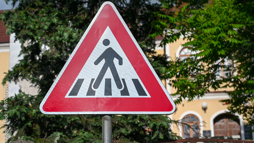 Traffic sign for a pedestrian crossing.
