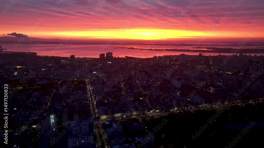 Sunset Skyline In Porto Alegre Rio Grande Do Sul Brazil. Breathtaking Aerial View Of A Lush Tropical Coastline Scenery. Sunset Sky Background Downtown Cityscape. Sunset Downtown Illumination. Sunset Skyline In Porto Alegre Rio Grande Do Sul Brazil. Breathtaking Aerial View Of A Lush Tropical Coastline Scenery. Sunset Sky Background Downtown Cityscape. Sunset Downtown Illumination.