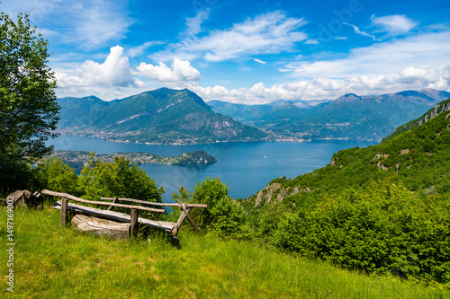 Panorama of Lake Como photographed at Alpe Mezzedo in Esino Lario, showing Bellagio, Balbianello, the Lecco and Como shores of the lake and the mountains above.

