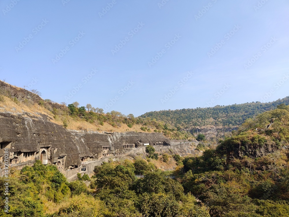 Fototapeta premium Ajanta and Ellora Caves, UNESCO World Heritage Sites in Maharashtra, India, showcase ancient rock-cut architecture, intricate carvings, and mesmerizing murals. Ajanta, known for its Buddhist caves, fe