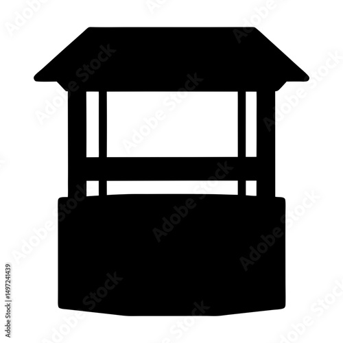 Silhouette image of a traditional style outdoor water well structure