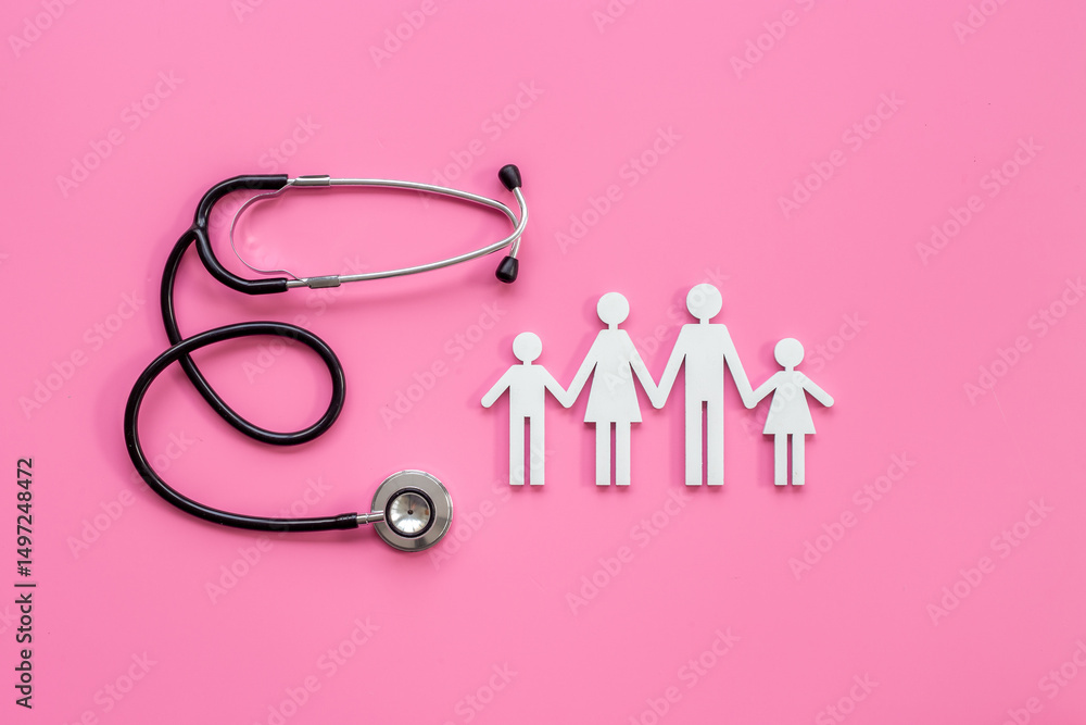 Fototapeta premium Family wooden figure with parents and children and medical stethoscope. Family medicine, medical and social insurance concept