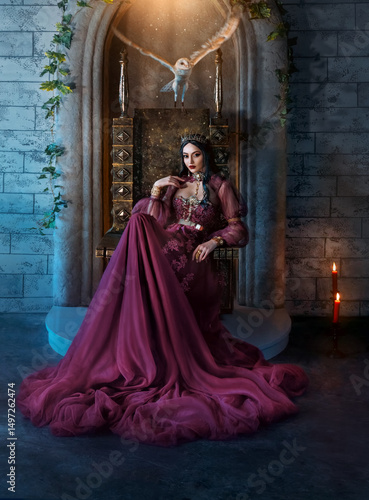 Schilderij op canvas Art photo real person fantasy woman evil elven queen sits on throne dark room, purple long dress
