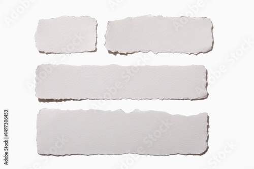 Torn white paper on white background