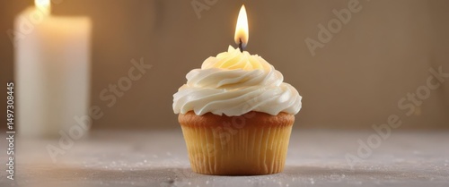 Wallpaper Mural Perfectly frosted vanilla cupcake with a lit candle ,  candlelight,  dessert Torontodigital.ca