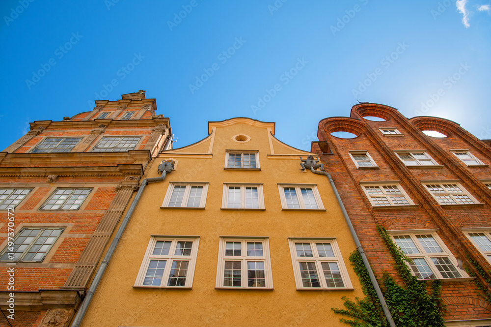 Fototapeta premium Old town in the Polish city of Gdansk with colorful facades of houses, Poland. Street architecture with old building. Travel photography.