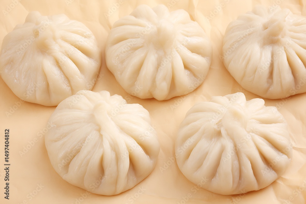 Delicious steamed dumplings on beige surface Delicious steamed dumplings on beige surface