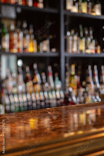 Bar counter with blurred image of bottles. Shallow depth of field.