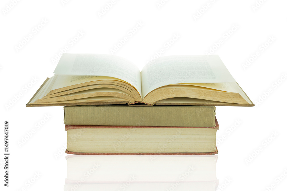 Old books are stacked and open isolated on white background with clipping path. Old books are stacked and open isolated on white background with clipping path.