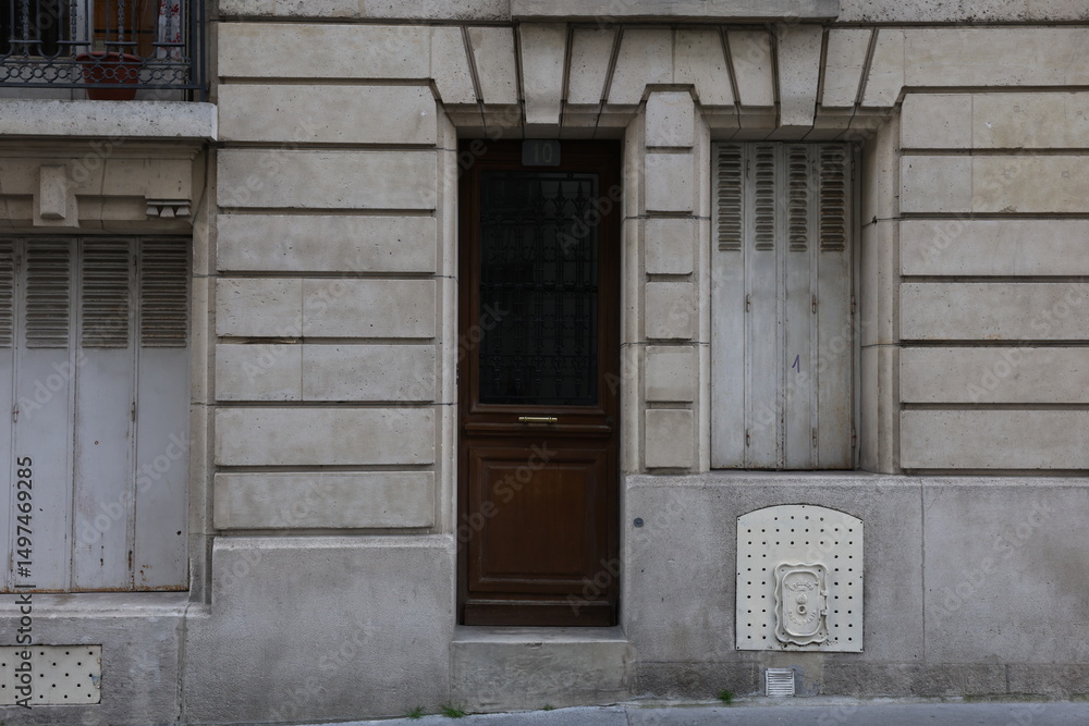 Naklejka premium Rustic Stone Building with Wooden Door and Number 
