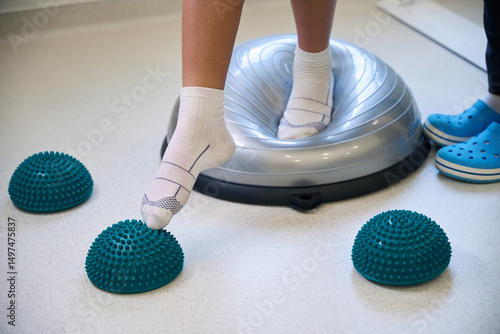 Close-up view of patients feet standing on soft balance pad