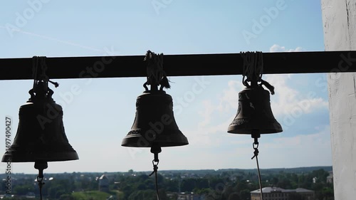 Wallpaper Mural The bells are hanging on a rope in the chapel tower against the sky. Close-up shooting Torontodigital.ca