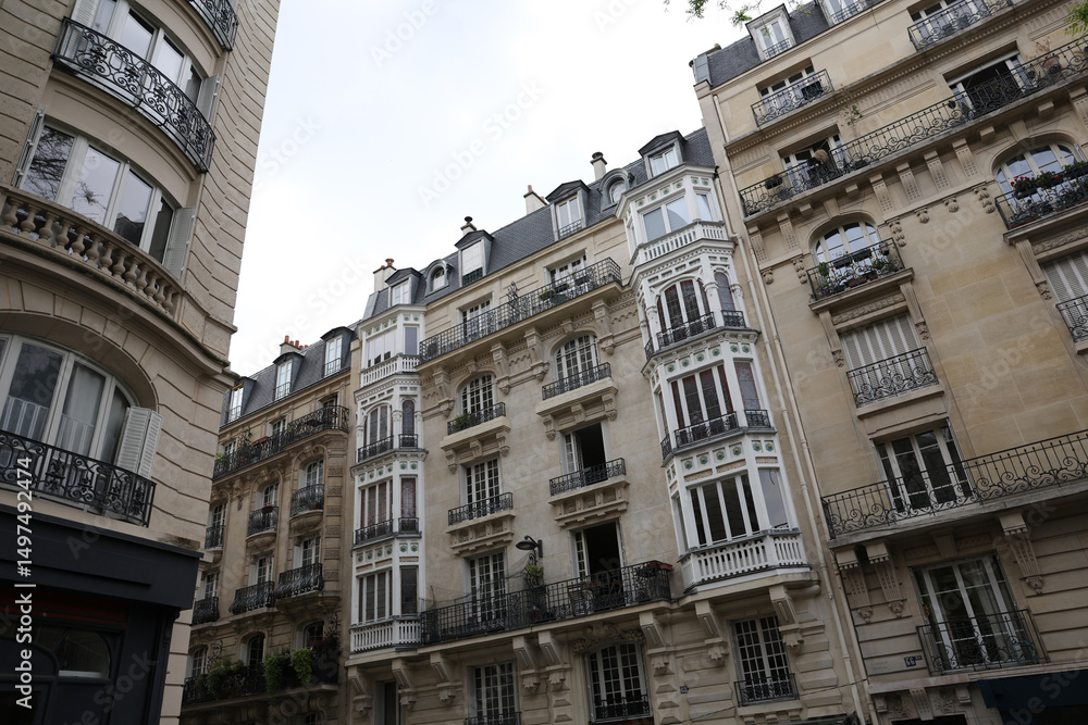 Fototapeta premium Classic European Residential Building with Ornate Balconies and Dormer Windows