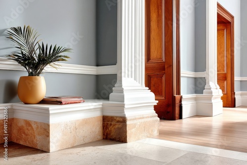 Elegant architecture with classic decor featuring columns and a potted plant