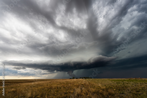 Menacing storm clouds fill the sky, bringing a threatening, dramatic scene with deep shadow, rich texture, and moody atmosphere, showcasing the raw power and beauty of nature’s weather.