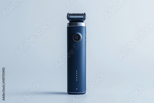 Close up of a dark blue electric trimmer with a silver head on a light blue background surface