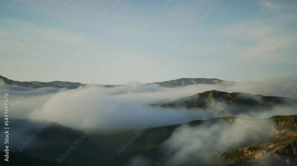 Majestic Mountain Covered by Clouds in a Serene Landscape Majestic Mountain Covered by Clouds in a Serene Landscape