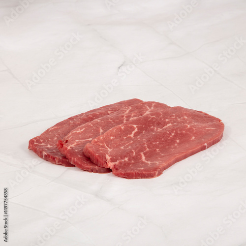 Three flap meat steak portions prepared for cooking on white background – High Resolution Raw Meat Image for Food Industry or Food Packaging