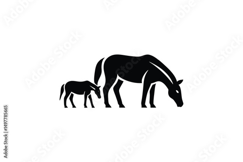 Majestic horse and foal silhouette grazing together