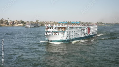 View of cruise boats sailing on the Nile River near Luxor on sunny morning, Luxor, Egypt, Africa