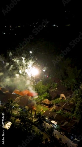 An aerial night view of a city with scattered lights