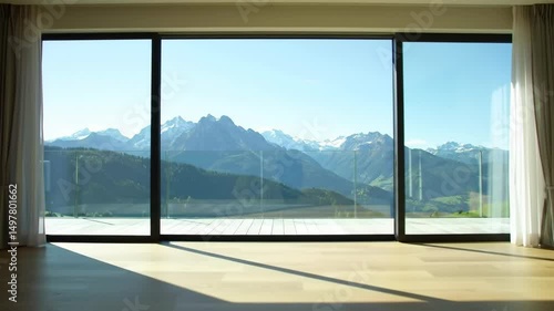 Interior View of Mountain Range from Modern Home with Large Windows Sunny Day