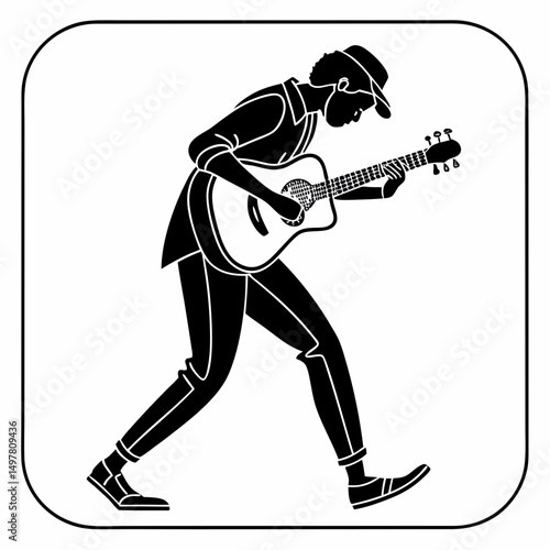 Silhouette of a man playing acoustic guitar walking