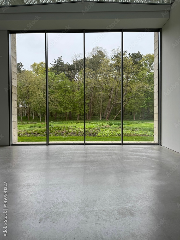 Fototapeta premium Empty room with panoramic windows and grey floor